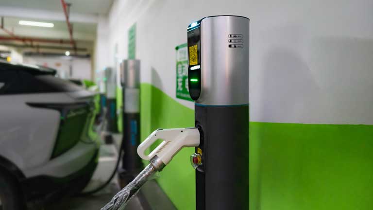 Closeup of charging station in underground parking lot.