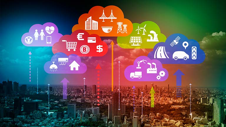 IoT concept image with icons in cloud bubbles over cityscape