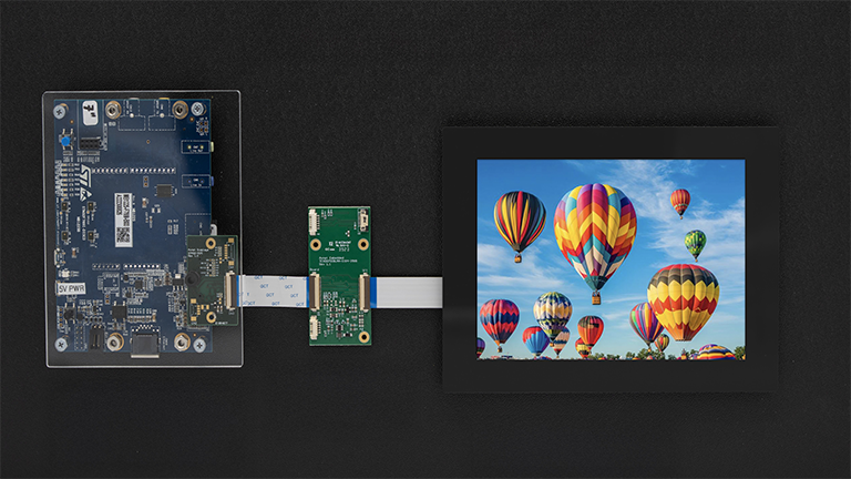 development board and tablet with balloons on screen