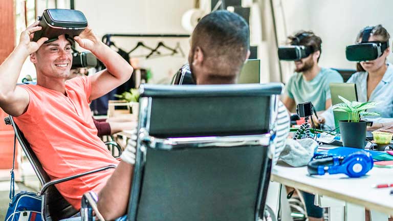 group of young people wearing virtual reality headsets