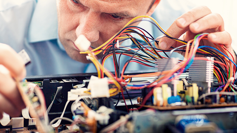 engineer assembling connectors