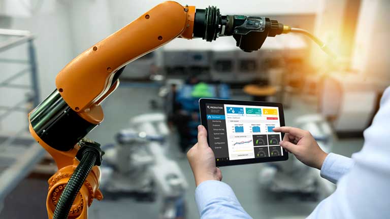 man using tablet computer in industrial setting